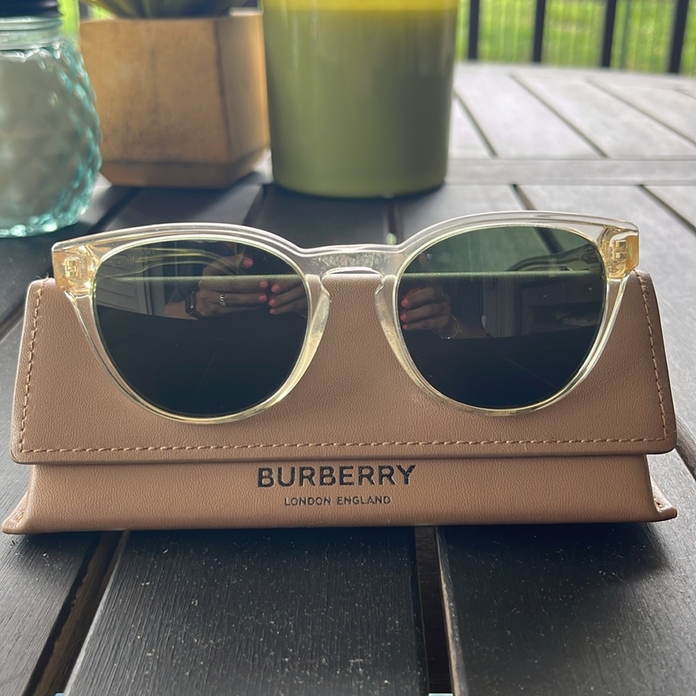 Burberry gold and clear sunglasses.